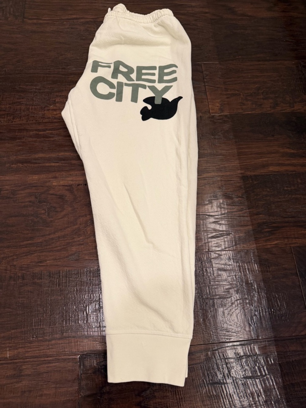 freecity Cream Track Pants with Green Logo and Black Dove